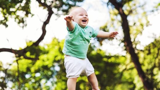 laughing baby floating on air